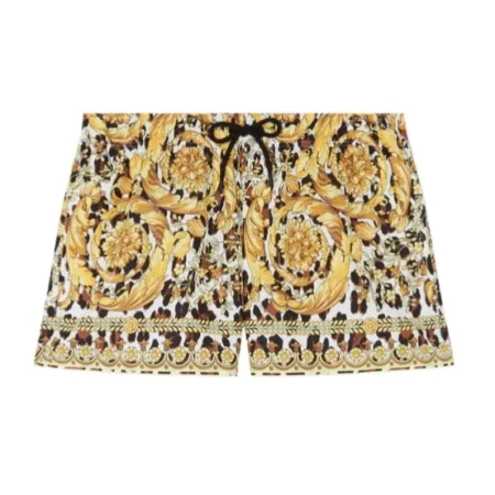 Versace Wild Barocco Swim Trunks featuring a bold baroque print, elastic waistband, and drawstring closure, available at Lestyle Boutique.